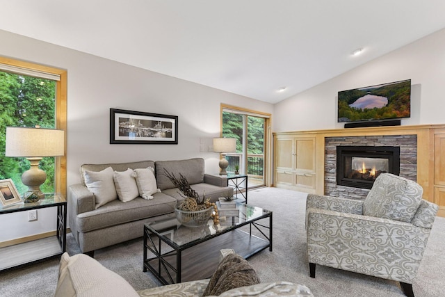 1614 Maple Manors Ct, Mound, MN 55364 - carpeted living room with vaulted ceiling and a stone fireplace