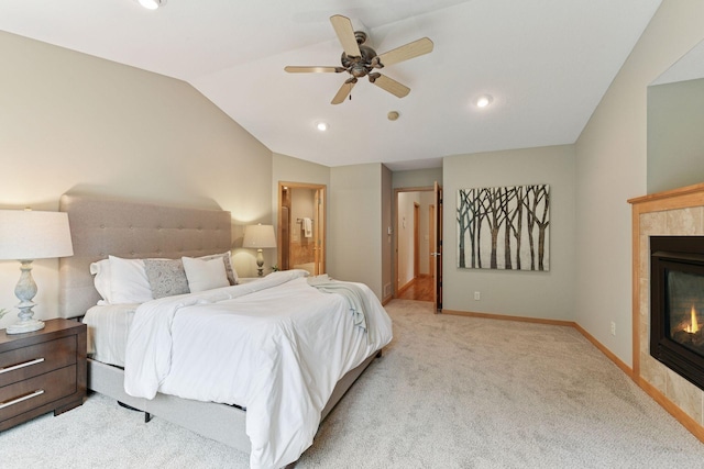 1614 Maple Manors Ct, Mound, MN 55364 - bedroom featuring vaulted ceiling, a tile fireplace, light colored carpet, recessed lighting, and ensuite bathroom