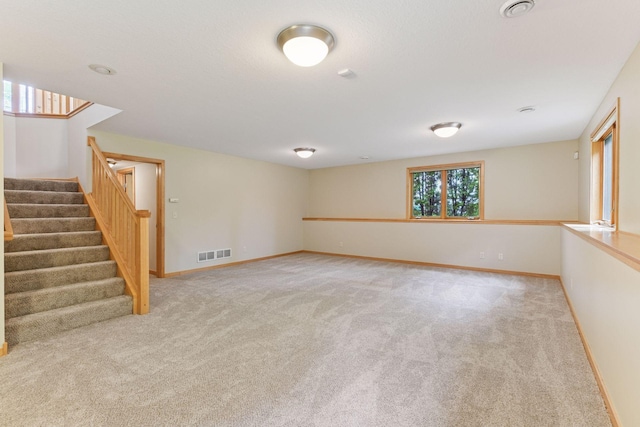 1614 Maple Manors Ct, Mound, MN 55364 - empty room featuring carpet flooring and stairs
