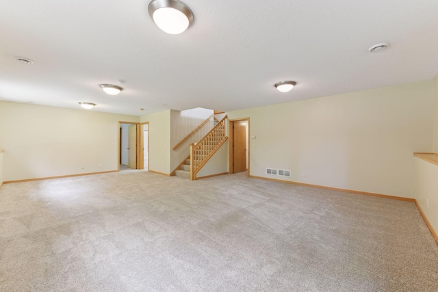 1614 Maple Manors Ct, Mound, MN 55364 - spare room featuring light colored carpet and stairs