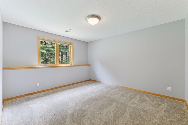 1614 Maple Manors Ct, Mound, MN 55364 - spare room featuring carpet floors and baseboards