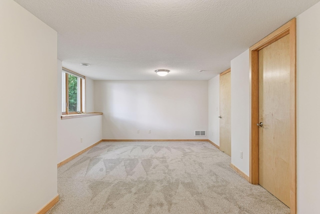 1614 Maple Manors Ct, Mound, MN 55364 - empty room featuring light colored carpet and a textured ceiling