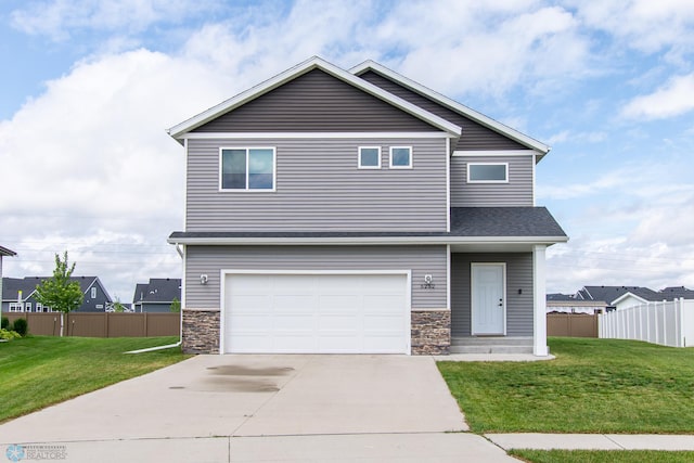 5252 8th Ct W, West Fargo, ND 58078 - view of front of house with stone siding, an attached garage, concrete driveway, and roof with shingles