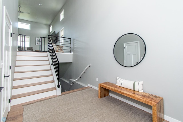 5252 8th Ct W, West Fargo, ND 58078 - staircase with baseboards and a ceiling fan