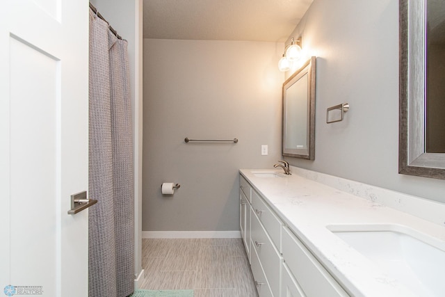 5252 8th Ct W, West Fargo, ND 58078 - full bathroom featuring double vanity and baseboards