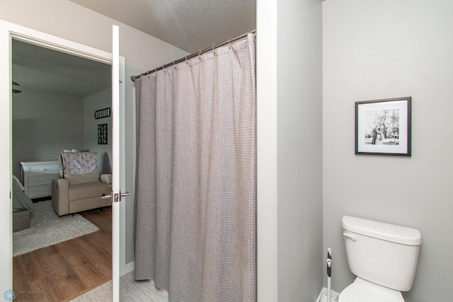 5252 8th Ct W, West Fargo, ND 58078 - bathroom featuring wood finished floors and a shower with shower curtain