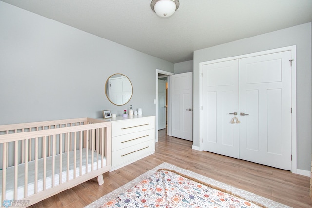 5252 8th Ct W, West Fargo, ND 58078 - bedroom with light wood-style flooring and a closet