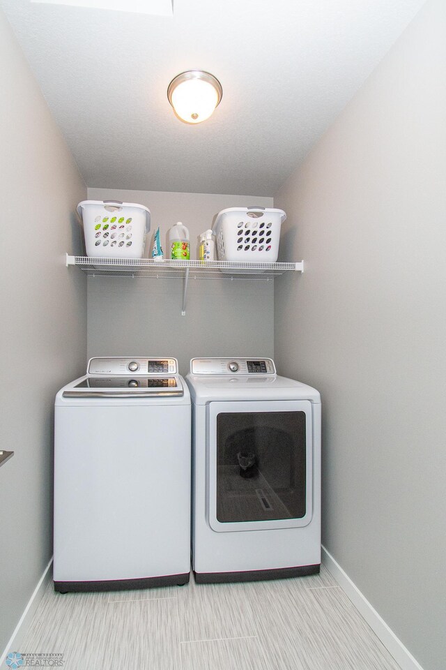 5252 8th Ct W, West Fargo, ND 58078 - washroom featuring separate washer and dryer and baseboards
