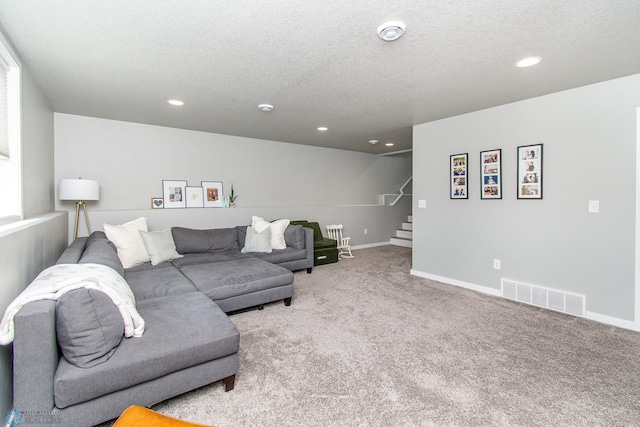 5252 8th Ct W, West Fargo, ND 58078 - carpeted living area with stairs, recessed lighting, and a textured ceiling
