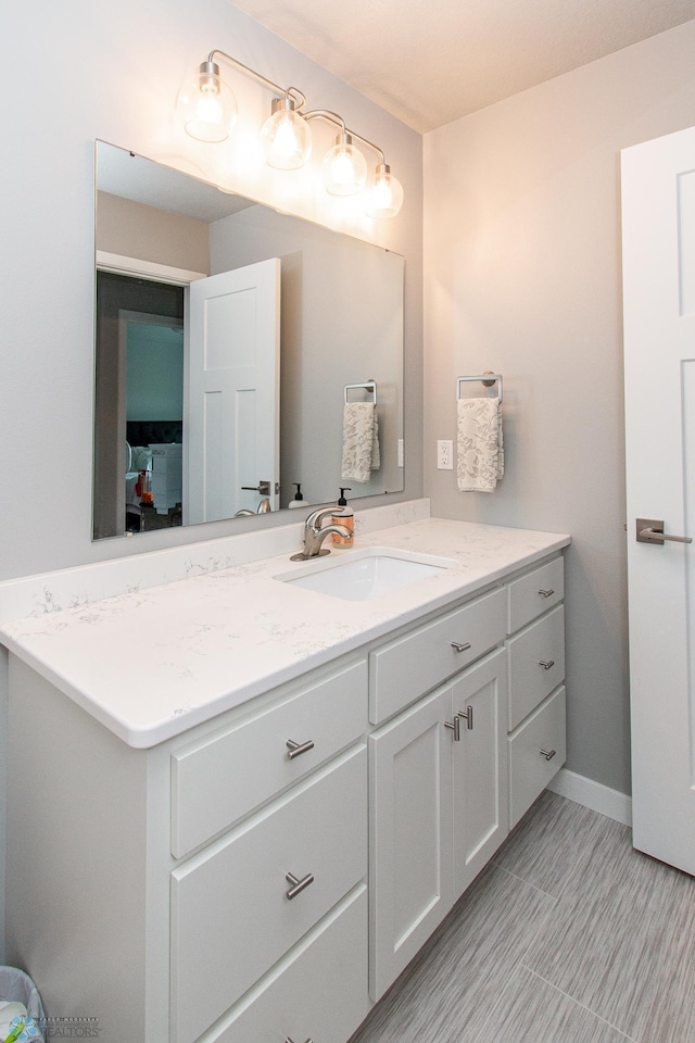 5252 8th Ct W, West Fargo, ND 58078 - bathroom featuring vanity and baseboards