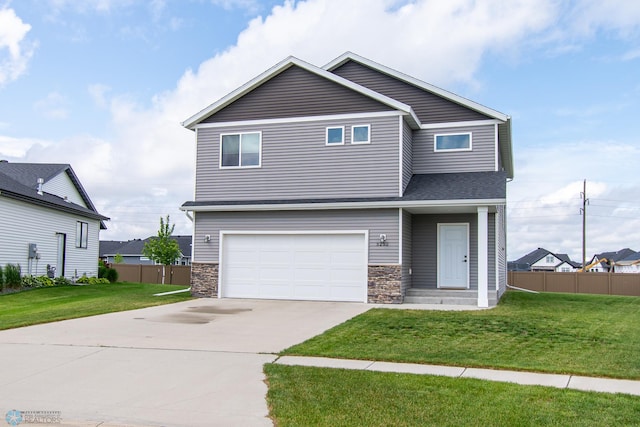 5252 8th Ct W, West Fargo, ND 58078 - view of front facade featuring a garage, concrete driveway, stone siding, and a shingled roof