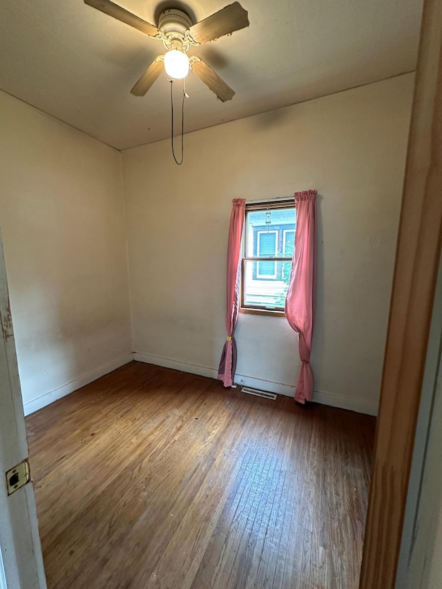 613 Cedar St, Luverne, MN 56156 - empty room with wood-type flooring and ceiling fan
