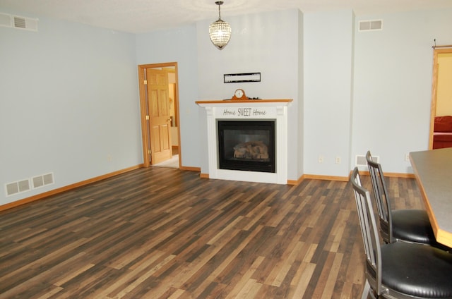 224 Goldfinch Ln, Clearwater, MN 55320 - living area featuring dark wood-style flooring and a glass covered fireplace