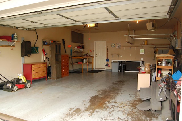 224 Goldfinch Ln, Clearwater, MN 55320 - garage with a workshop area and a garage door opener