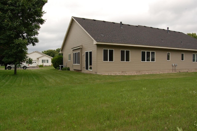 224 Goldfinch Ln, Clearwater, MN 55320 - rear view of house with a lawn and a shingled roof