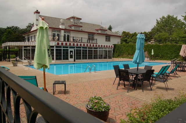 224 Goldfinch Ln, Clearwater, MN 55320 - community pool featuring a patio