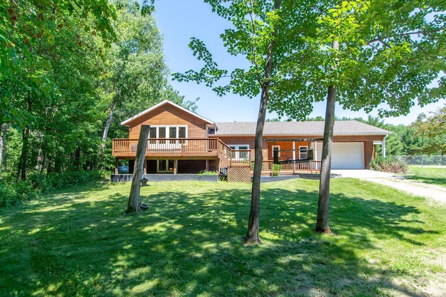 8290 Gladstone Lake Rd, Brainerd, MN 56401 - view of front of home featuring a garage, a deck, concrete driveway, and a front yard