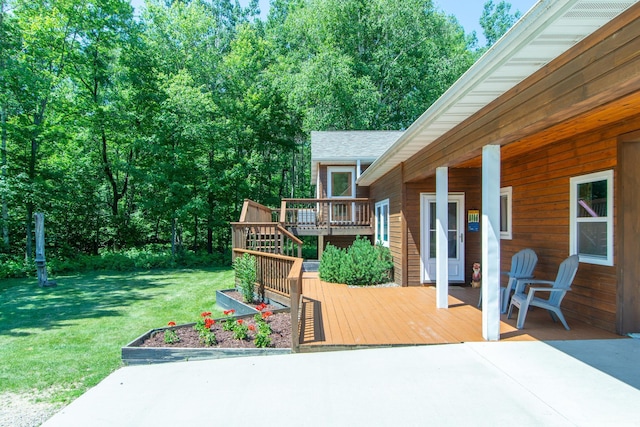 8290 Gladstone Lake Rd, Brainerd, MN 56401 - wooden terrace with a lawn and a patio
