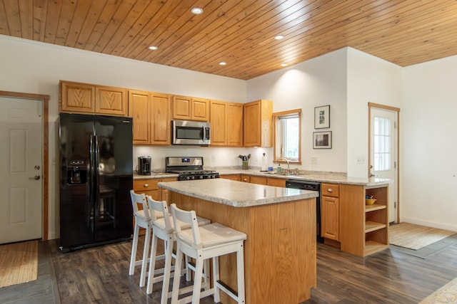 8290 Gladstone Lake Rd, Brainerd, MN 56401 - kitchen with black appliances, wood ceiling, dark wood-style flooring, a kitchen island, and light countertops