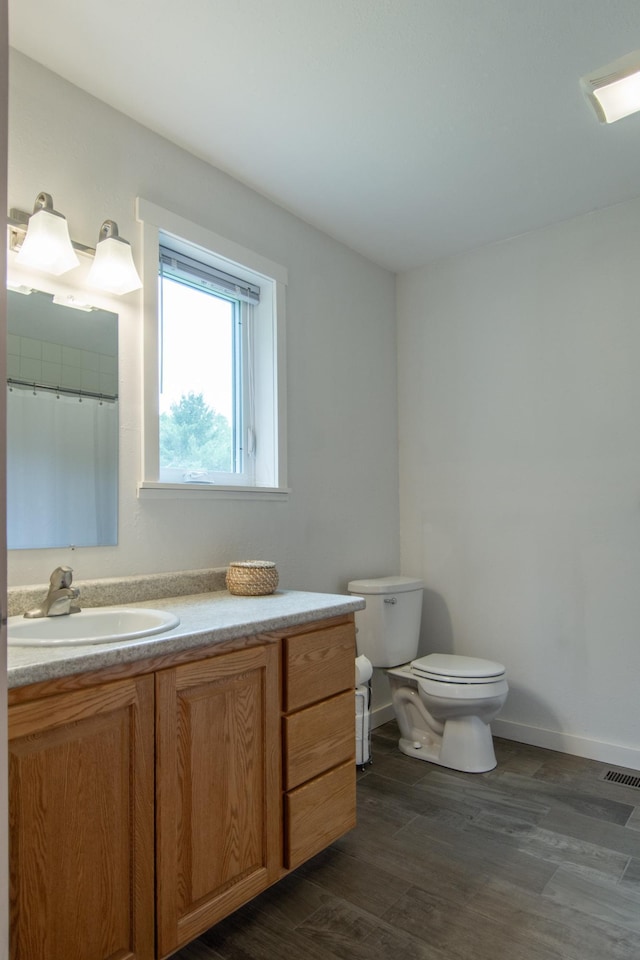 8290 Gladstone Lake Rd, Brainerd, MN 56401 - full bathroom with vanity and wood finished floors
