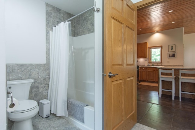 8290 Gladstone Lake Rd, Brainerd, MN 56401 - full bath with tile walls, vanity, wooden ceiling, shower / bath combo, and tile patterned floors