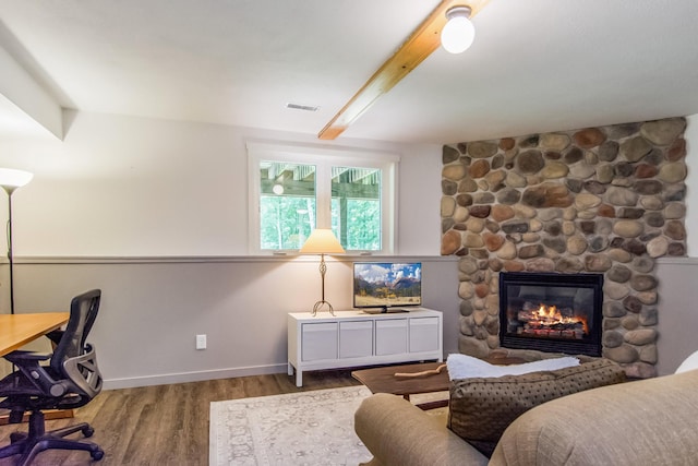 8290 Gladstone Lake Rd, Brainerd, MN 56401 - office space with wood finished floors, a fireplace, and beamed ceiling