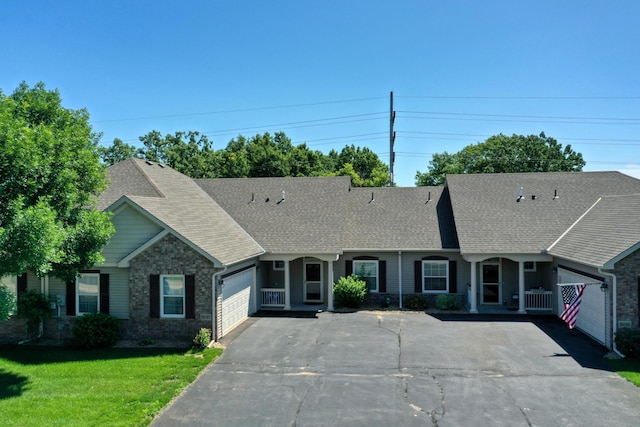 5010 384th Trl, North Branch, MN 55056 - view of front of house featuring a garage, a shingled roof, asphalt driveway, and a front lawn