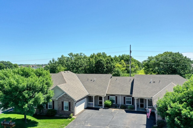 5010 384th Trl, North Branch, MN 55056 - ranch-style house featuring a shingled roof, an attached garage, a front yard, and asphalt driveway