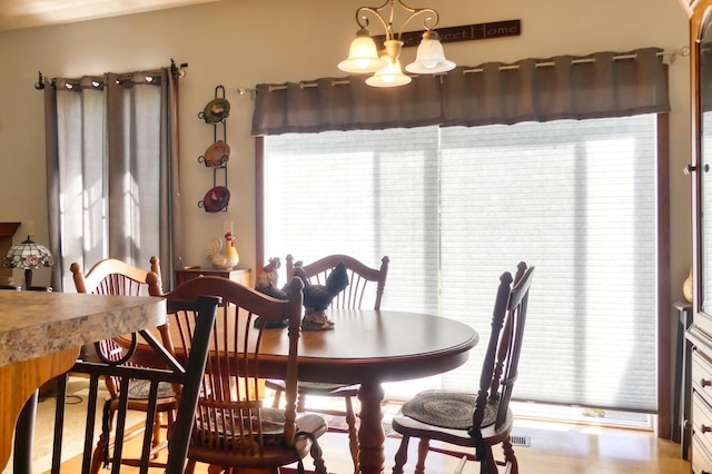 5010 384th Trl, North Branch, MN 55056 - dining room with a chandelier
