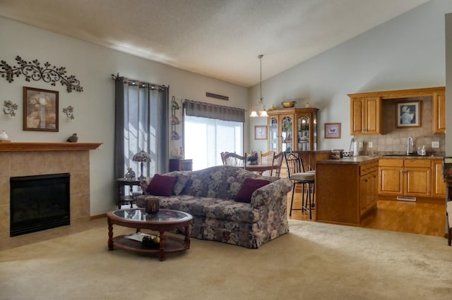 5010 384th Trl, North Branch, MN 55056 - living area with carpet, lofted ceiling, and a tile fireplace