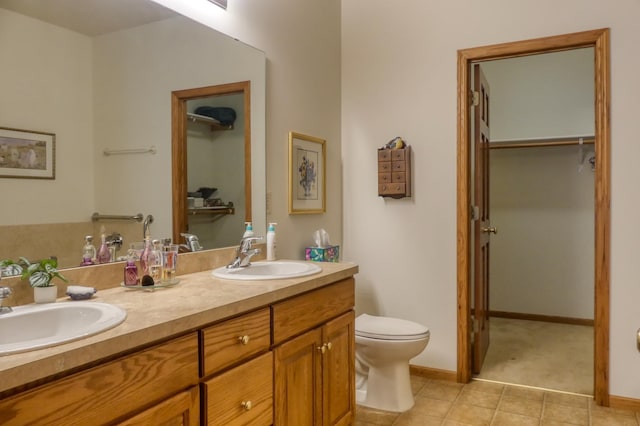 5010 384th Trl, North Branch, MN 55056 - full bathroom with double vanity, tile patterned floors, and a walk in closet