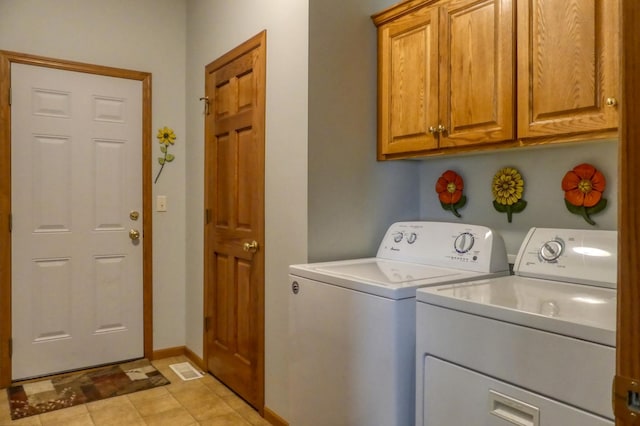 5010 384th Trl, North Branch, MN 55056 - laundry room with independent washer and dryer, cabinet space, and light tile patterned floors