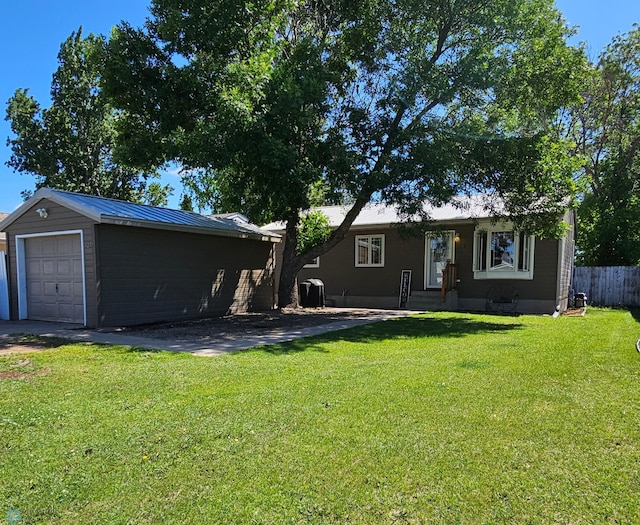 327 6th Ave, Mapleton, ND 58059 - back of house featuring a garage, an outdoor structure, and a metal roof