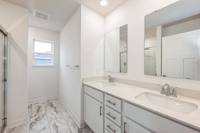 10280 187th Ave NW, Elk River, MN 55330 - bathroom featuring marble look tiles, double vanity, a shower stall, and recessed lighting