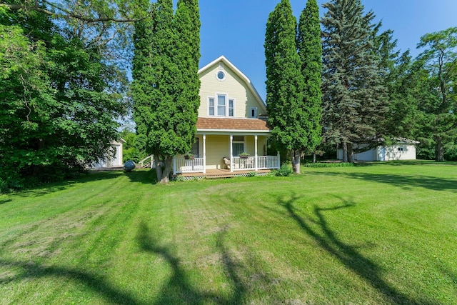 11826 State Road 48, Frederic, WI 54837 - rear view of property with a porch and a lawn