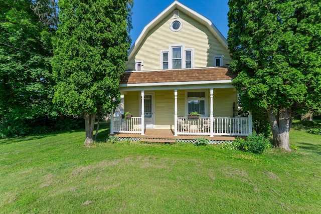 11826 State Road 48, Frederic, WI 54837 - dutch colonial with a gambrel roof, covered porch, a front lawn, and roof with shingles