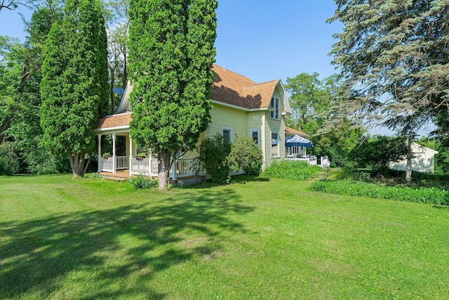 11826 State Road 48, Frederic, WI 54837 - view of green lawn with a porch
