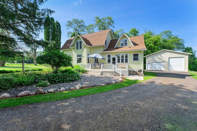 11826 State Road 48, Frederic, WI 54837 - view of front of house featuring an outdoor structure, a garage, a deck, and a shingled roof