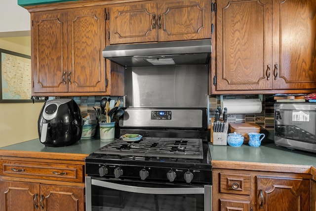 11826 State Road 48, Frederic, WI 54837 - kitchen with ventilation hood, stainless steel appliances, decorative backsplash, and brown cabinets