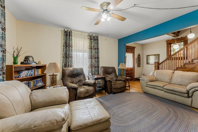 11826 State Road 48, Frederic, WI 54837 - living room with wood finished floors, a ceiling fan, and stairs