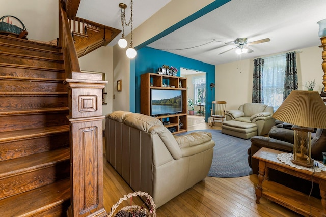 11826 State Road 48, Frederic, WI 54837 - living area featuring light wood finished floors, a ceiling fan, and stairway