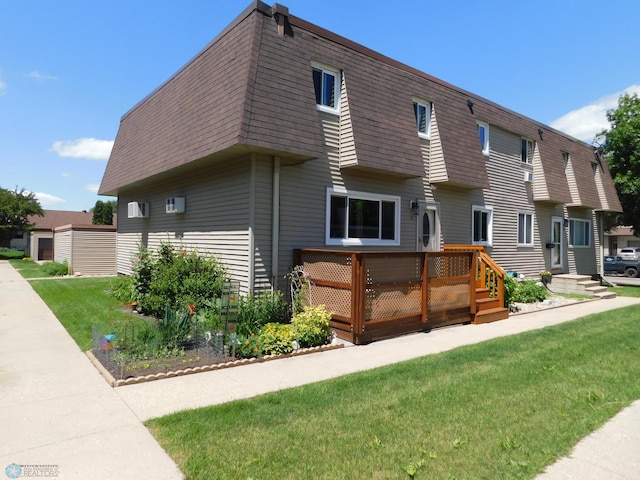 961 4th Ave W Unit B, West Fargo, ND 58078 - view of front of house with roof with shingles, mansard roof, a wooden deck, and a front yard