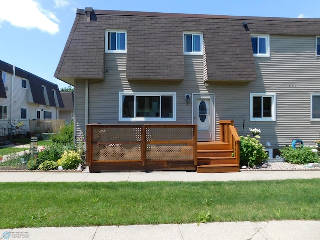 961 4th Ave W Unit B, West Fargo, ND 58078 - view of front of home featuring a shingled roof, mansard roof, and a deck