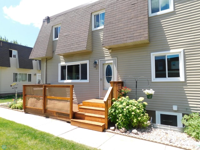 961 4th Ave W Unit B, West Fargo, ND 58078 - view of front of house featuring a shingled roof and mansard roof