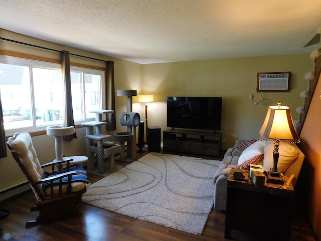 961 4th Ave W Unit B, West Fargo, ND 58078 - living room featuring a wall mounted air conditioner, wood finished floors, and a textured ceiling