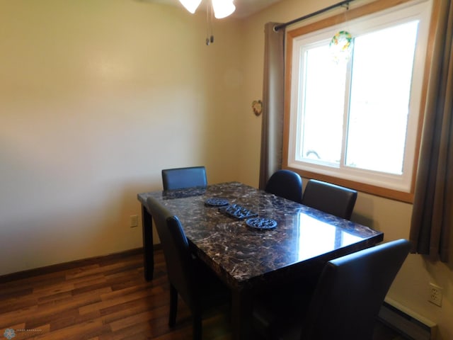 961 4th Ave W Unit B, West Fargo, ND 58078 - dining space featuring baseboard heating, dark wood-style flooring, and ceiling fan
