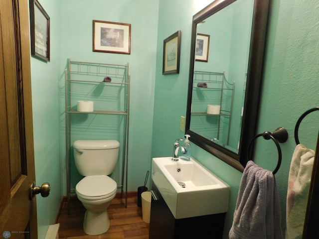 961 4th Ave W Unit B, West Fargo, ND 58078 - half bath featuring wood finished floors and vanity