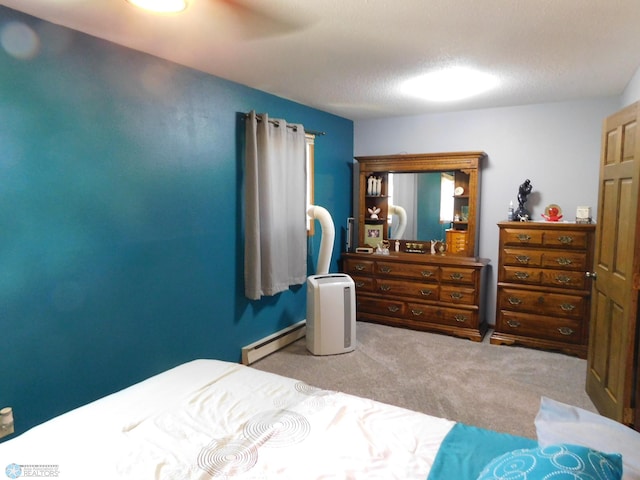 961 4th Ave W Unit B, West Fargo, ND 58078 - carpeted bedroom featuring a baseboard radiator and a ceiling fan