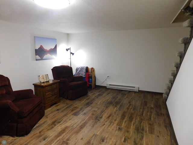 961 4th Ave W Unit B, West Fargo, ND 58078 - living area featuring baseboard heating, wood finished floors, and stairway