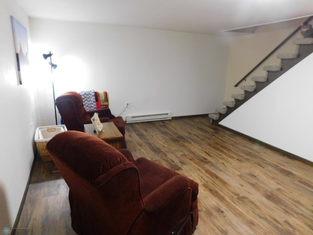 961 4th Ave W Unit B, West Fargo, ND 58078 - living room featuring a baseboard heating unit, stairway, and wood finished floors